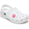 Ciondoli Jibbitz™ a forma di fiore rosa con perla al centro Ciondoli Jibbitz™ a forma di fiore rosa con perla al centro