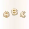 Ciondoli Jibbitz™ con la lettera “a” dorata a forma di bolla Ciondoli Jibbitz™ con la lettera “a” dorata a forma di bolla